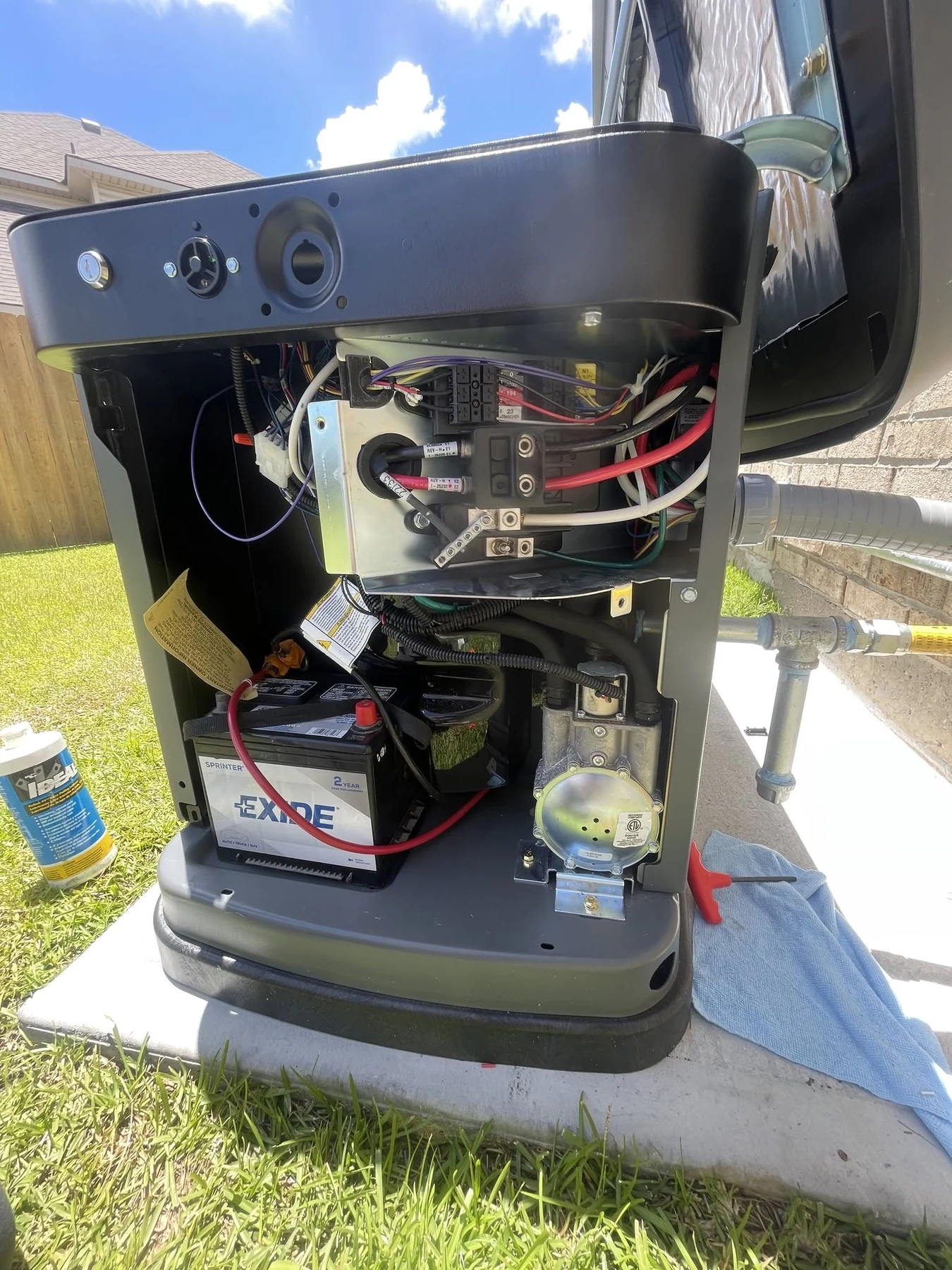 Standby generator being serviced at an Acadiana home